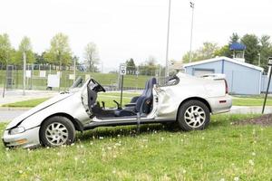 crashed car on field photo