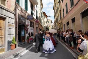 GENOA, ITALY - MAY 5 2018 - 19 century dress parade for Euroflora Exhibit in the unique scenario of the Nervi photo