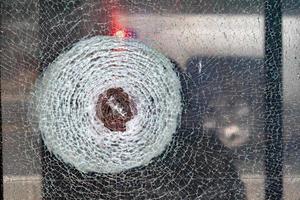 broken bulletproof glass close up photo