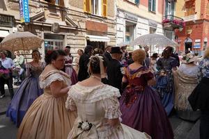 GENOA, ITALY - MAY 5 2018 - 19 century dress parade for Euroflora Exhibit in the unique scenario of the Nervi photo