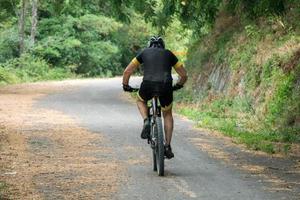 Mountain biker on a bike photo