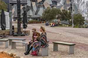 MELBOURNE, AUSTRALIA - AUGUST 15 2017 - Tourist and students in Federation Square photo