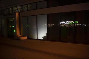 Light in display case at night. Light from building. Showcase details. photo