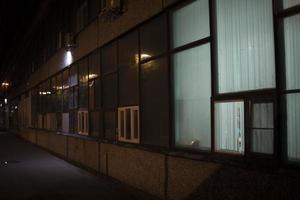 Window in building. Single window. Light in dark interior. Glass in evening. photo