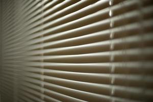 Blinds in office. Interior details. Window is closed from light. Protection from spicy sunlight. photo