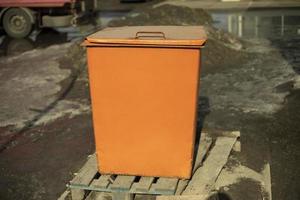 Orange waste tank. Dumpster. photo