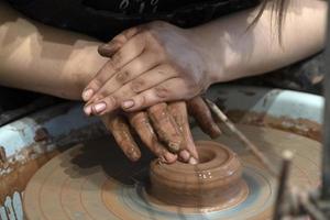 hands while crafting pottery detail close up photo