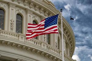 Washington DC capitol with waving flag photo