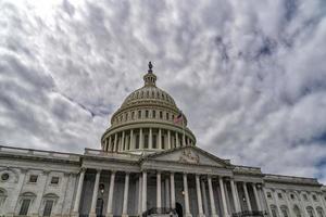 Washington DC capitol with waving flag photo