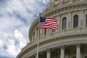 Washington DC capitol with waving flag photo