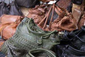 many leather woman bags at the market photo