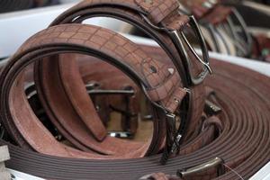 many leather belts in italian market for sale photo