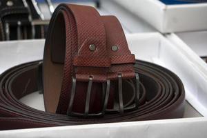 many leather belts in italian market for sale photo