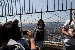 NEW YORK, USA - MAY 25 2018 - Empire state building crowded of tourists photo