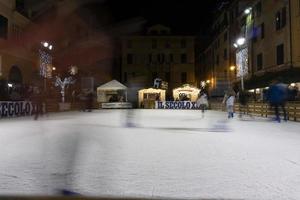 CHIAVARI, ITALY - DECEMBER 23, 2018 - Historical medieval town ice skating is open photo