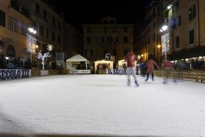 CHIAVARI, ITALY - DECEMBER 23, 2018 - Historical medieval town ice skating is open photo