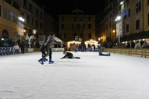 CHIAVARI, ITALY - DECEMBER 23, 2018 - Historical medieval town ice skating is open photo