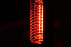 electric heater detail isolated on black photo