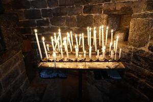 church votive candles white flames photo