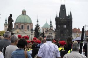 PRAGUE, CZECH REPUBLIC - JULY 15 2019 - Charles Bridge is full of tourist in summer time photo