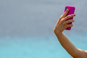 selfie of woman on tropical polynesian beach photo