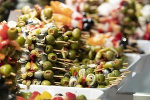 olive skewers at the market photo