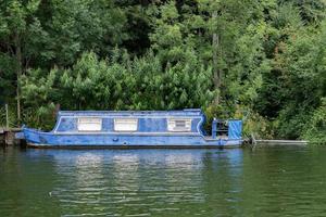 rusty rugged ship in thames river photo