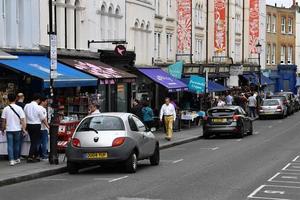 LONDON, ENGLAND - JULY 15 2017 - portobello road london street colorful marketplace photo