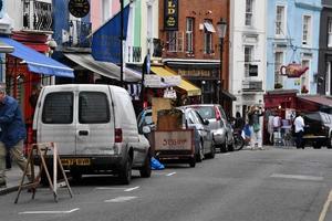 LONDON, ENGLAND - JULY 15 2017 - portobello road london street colorful marketplace photo