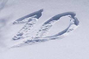 10 ten number writing on the snow photo