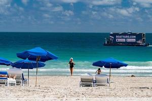 MIAMI, USA - FEBRUARY 2, 2017 - boat advertising for people relaxing in miami beach promenade waterfront photo