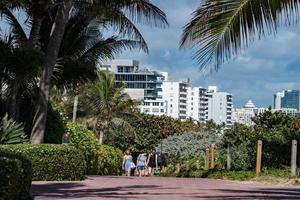 MIAMI, USA - FEBRUARY 2, 2017 - people relaxing in miami beach promenade waterfront photo