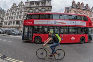 LONDON, ENGLAND - JULY 16 2017 - Tourists and locals in Piccadilly Circus congested town traffic photo