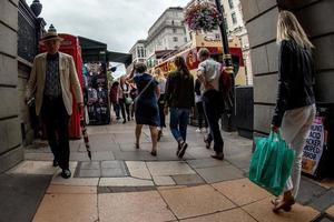 LONDON, ENGLAND - JULY 16 2017 - Tourists and locals in Piccadilly Circus congested town traffic photo