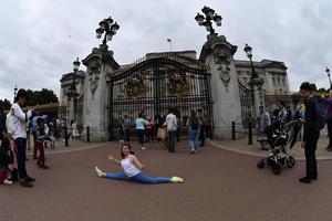 LONDON, ENGLAND - JULY 15 2017 - Tourist taking pictures at Buckingham Palace photo