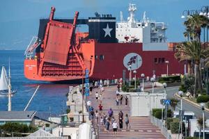 GENOA, ITALY - MAY 26, 2017 - container ship near the shore before entering harbor photo