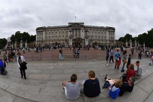 LONDON, ENGLAND - JULY 15 2017 - Tourist taking pictures at Buckingham Palace photo