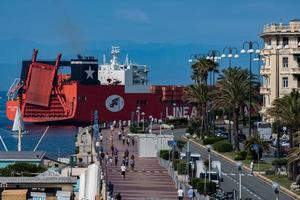 GENOA, ITALY - MAY 26, 2017 - container ship near the shore before entering harbor photo