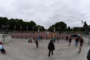 LONDON, ENGLAND - JULY 15 2017 - Tourist taking pictures at Buckingham Palace photo