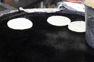 mexican tortillas while cooking detail photo