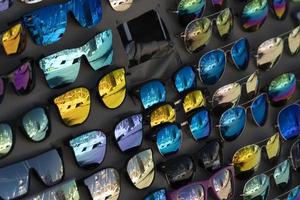 many sunglasses for sale on display photo