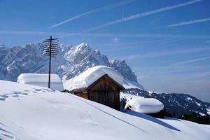 dolomites snow panorama big landscape hut covered by snow photo