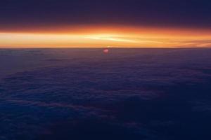 Sunrise from airplane window photo