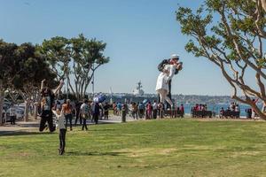 SAN DIEGO, USA - NOVEMBER 14, 2015 - People taking a selfie at sailor and nurse while kissing statue san diego photo