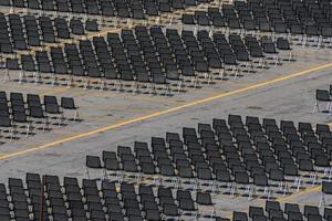 Many empty chairs without audience photo