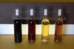 Different bottles of Azores wine red, rose, orange, white photo