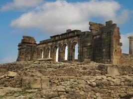 Volubilis Roman ruins in Morocco- Best-preserved Roman ruins located between the Imperial Cities of Fez and Meknes photo