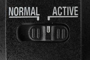 Normal Active switch on black background photo