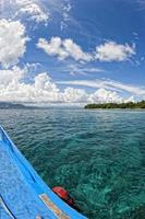 A boat on the reef in tropical paradise photo