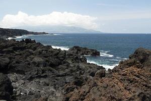 Lajido village Pico Island Azores black lava houses red windows photo